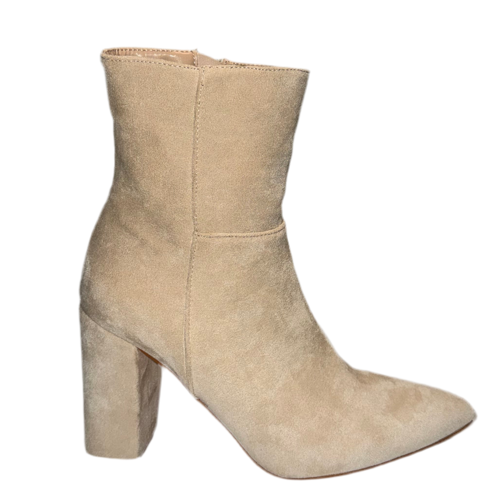 Beige ankle boot on a white background