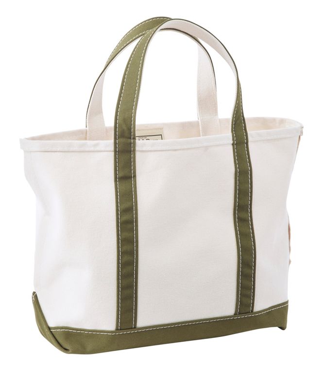 White tote bag with green straps on a white background