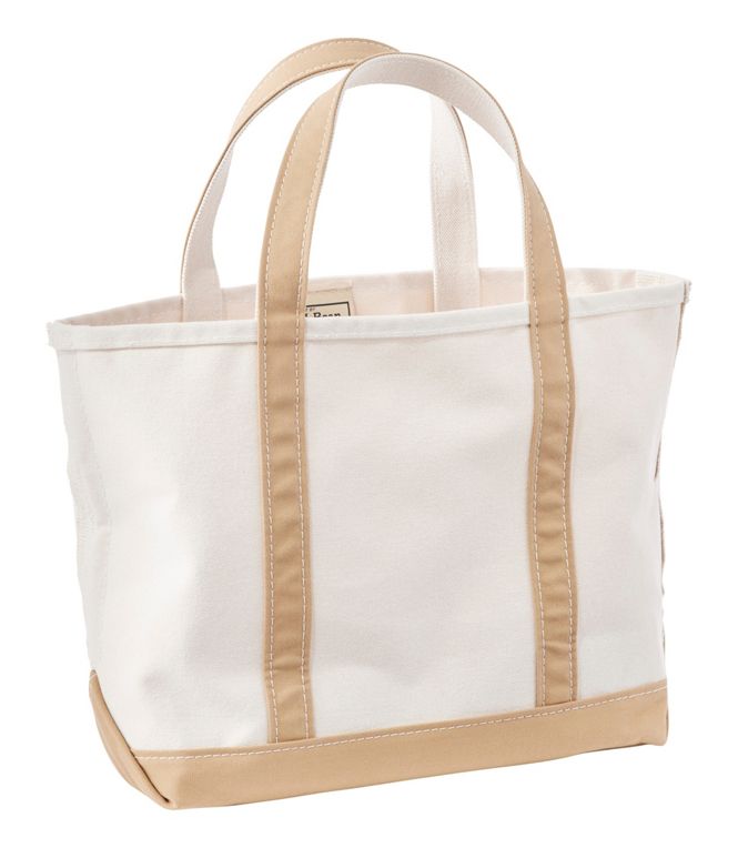 White tote bag with beige handles and trim on a white background