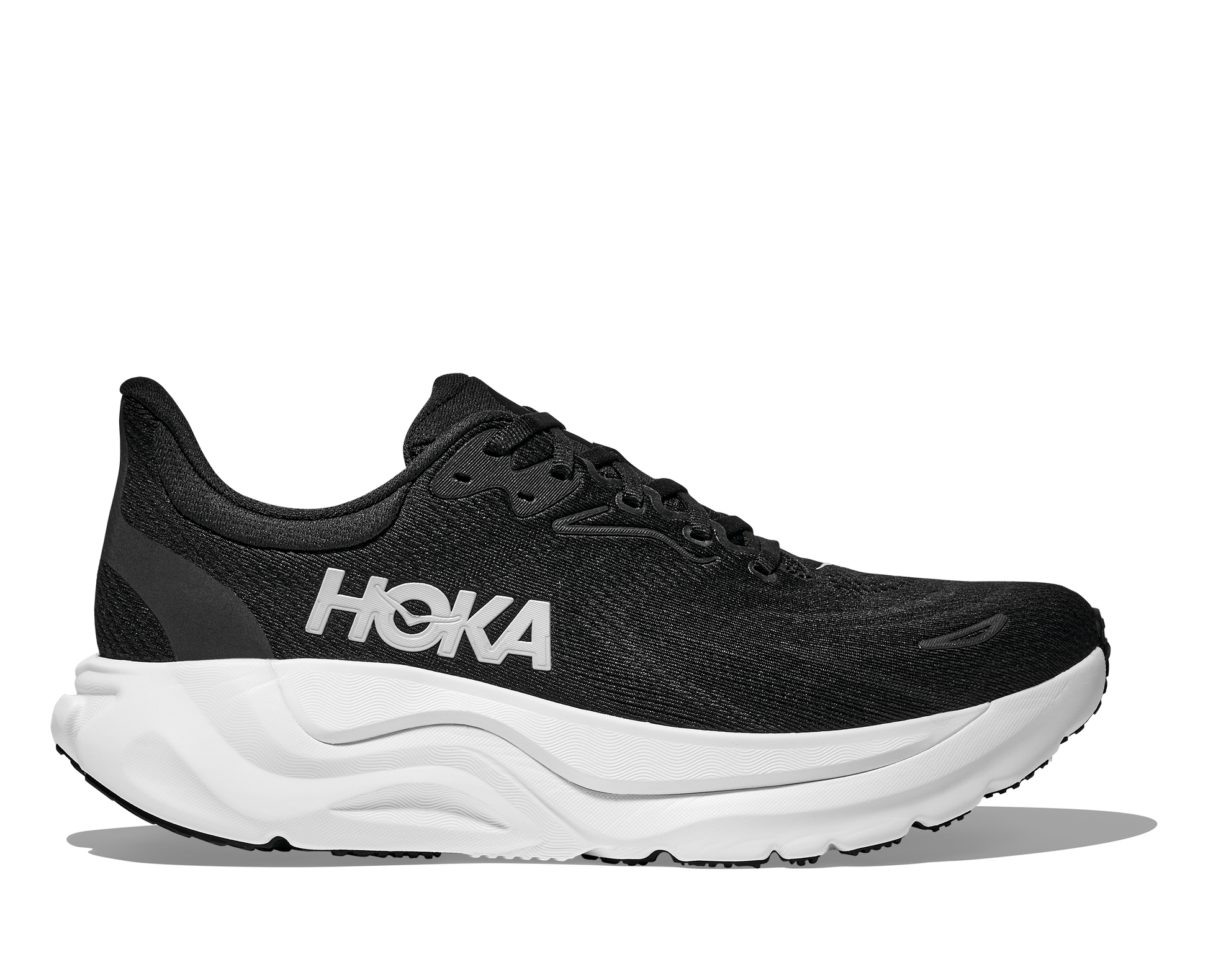 Black running shoe with white sole and 'Hoka' branding on a white background