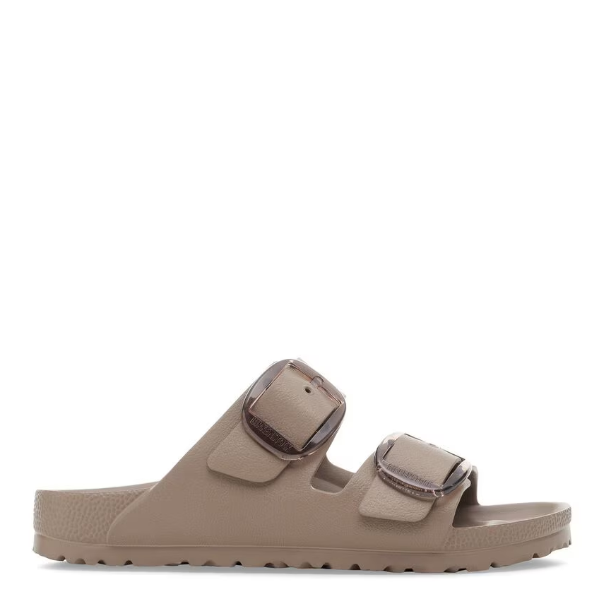 Beige sandal with brown straps on a white background