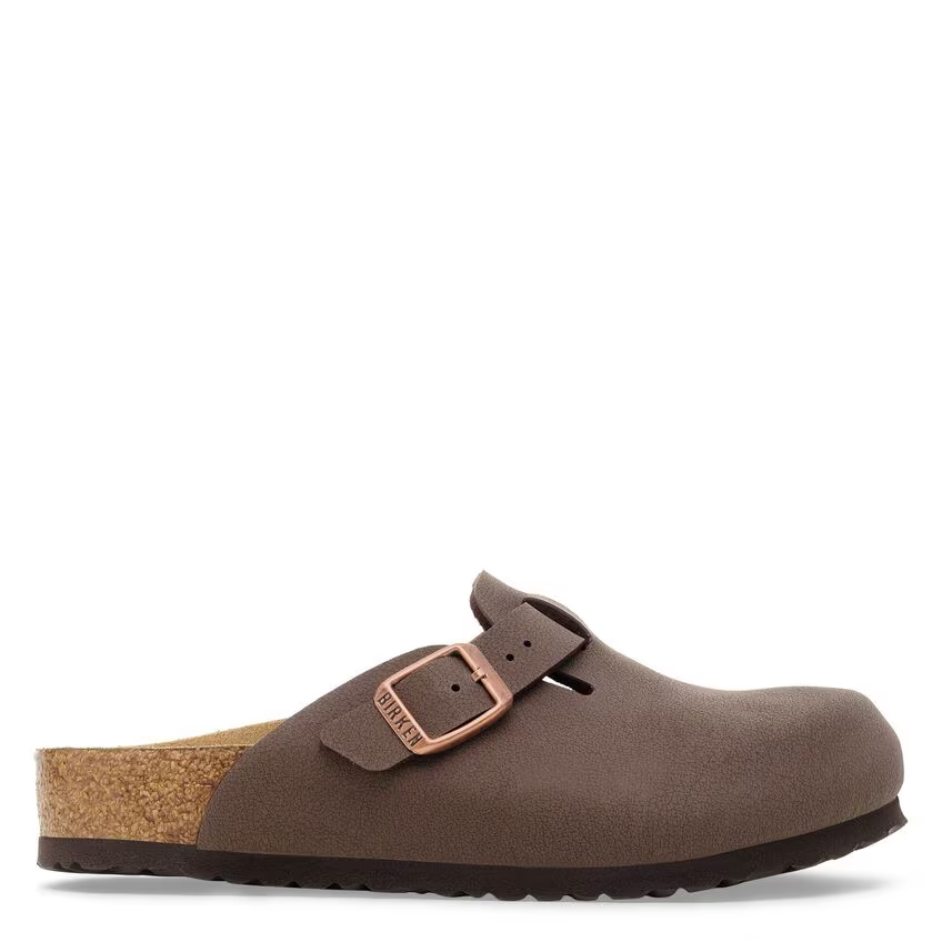 Brown clog shoe with a buckle on a white background