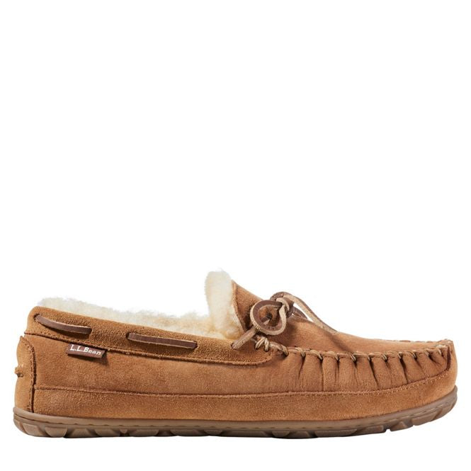 Brown moccasin slipper with fur lining on a white background
