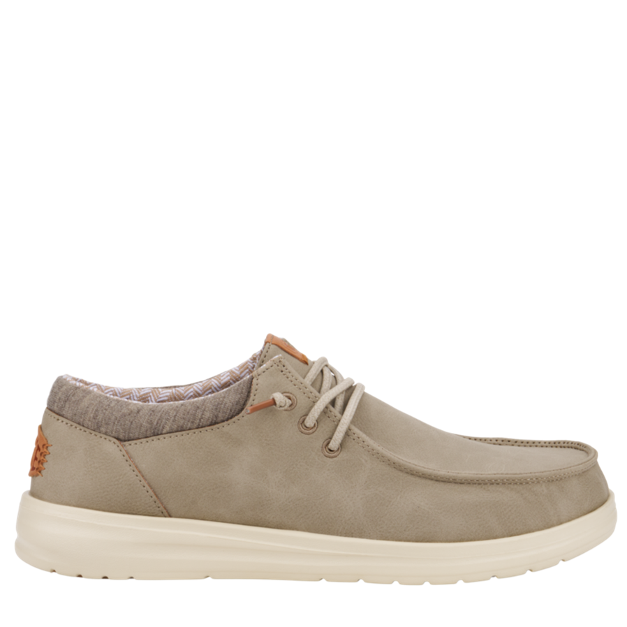 Beige casual shoe on a white background