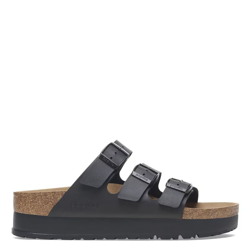 Black sandal with cork sole on a white background