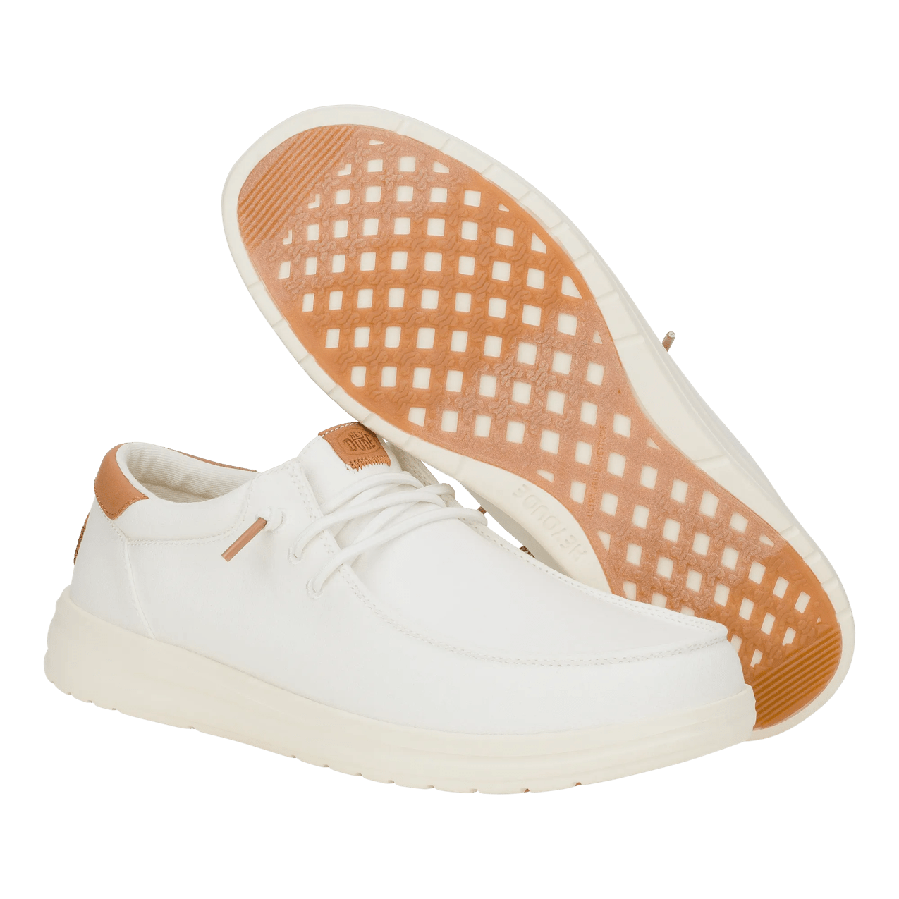 White sneaker with brown accents on a transparent background