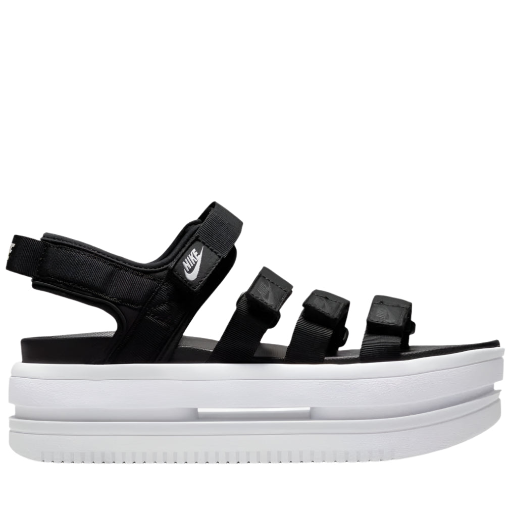 A pair of women's Nike Icon Classic sandals in black color with a white midsole and Air Force 1 detailing.