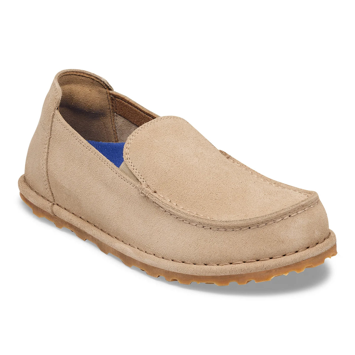A single slip-on loafer in light beige suede, shown from a three-quarters angle on a white background.