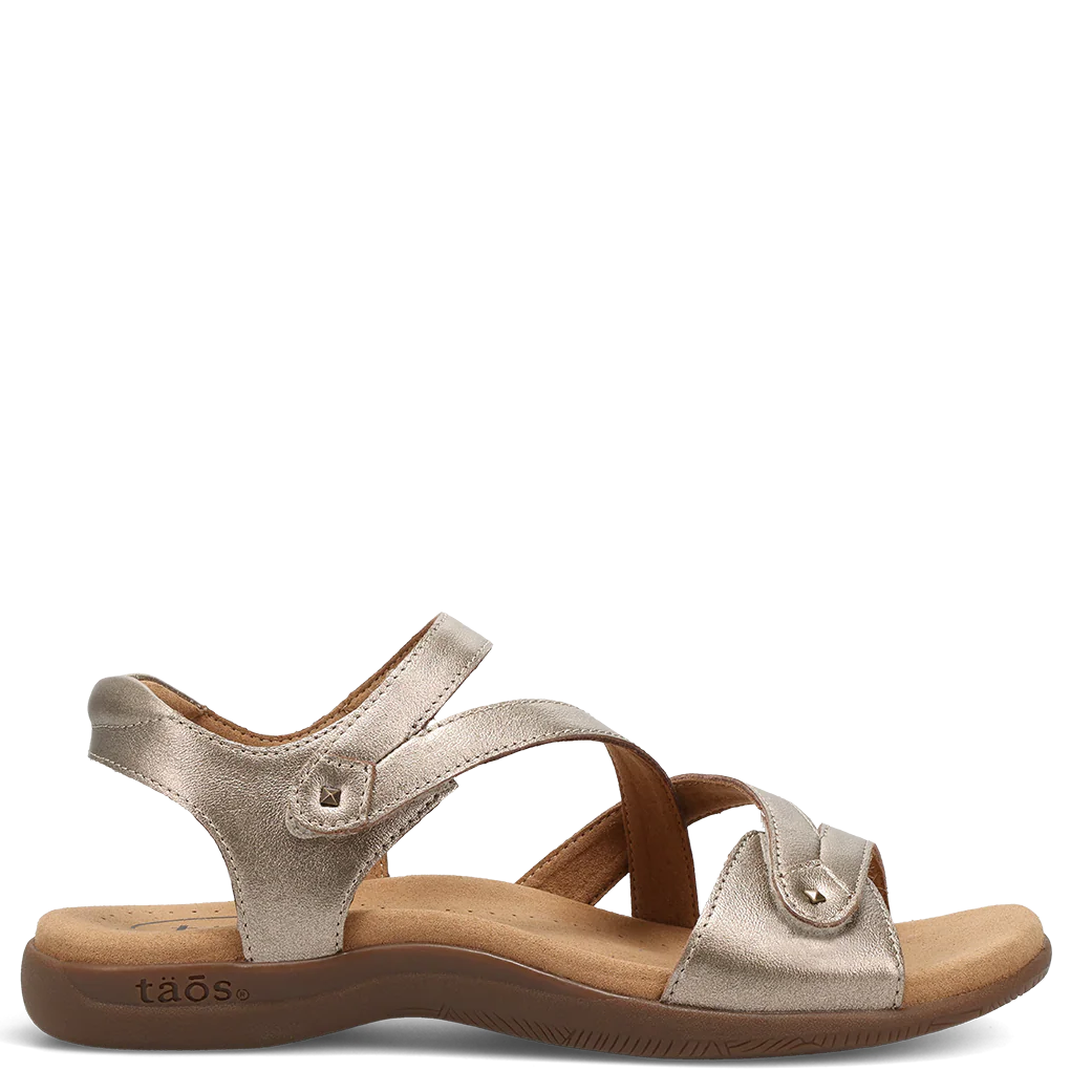 Gold sandal with a white background