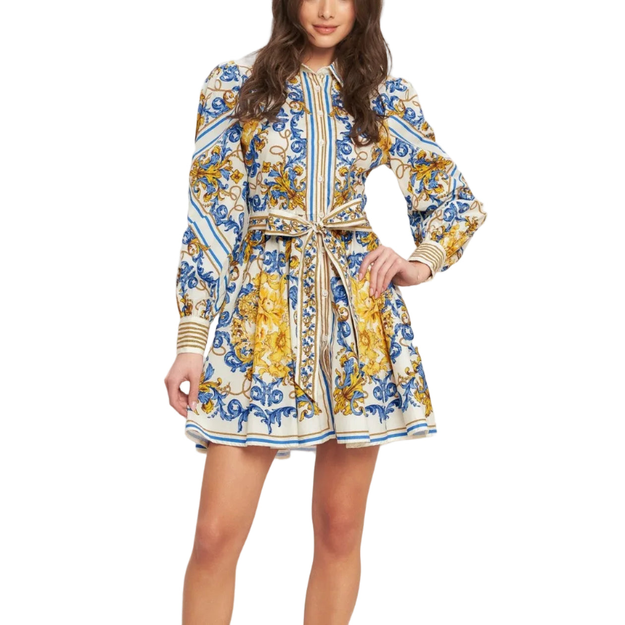 Woman wearing a patterned dress with long sleeves on a white background