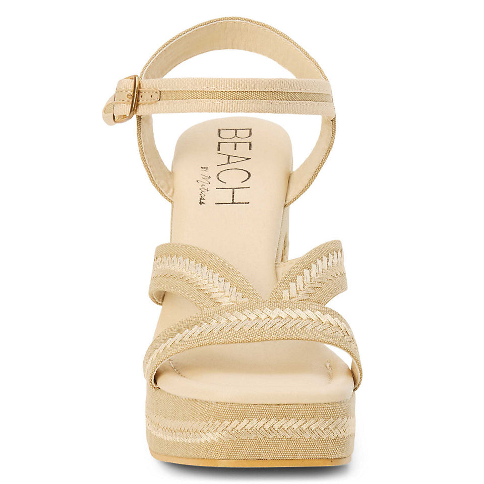 Beige sandal with woven details on a white background
