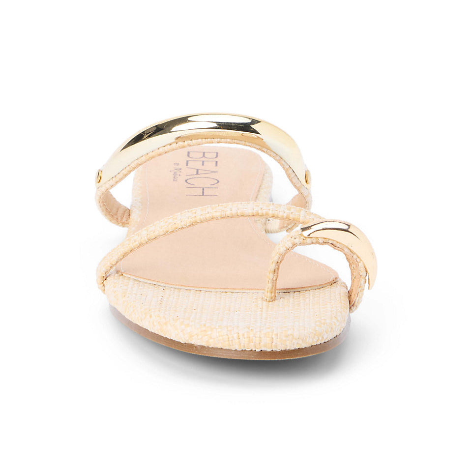 Beige sandal with gold strap on a white background