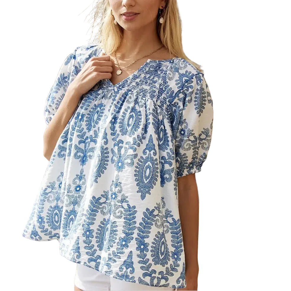 Woman wearing a blue and white patterned top