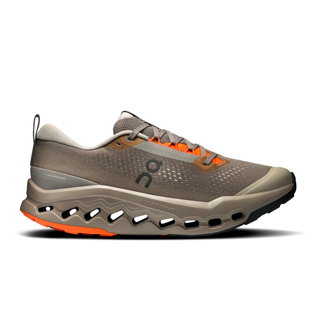Gray running shoe with orange accents on a white background