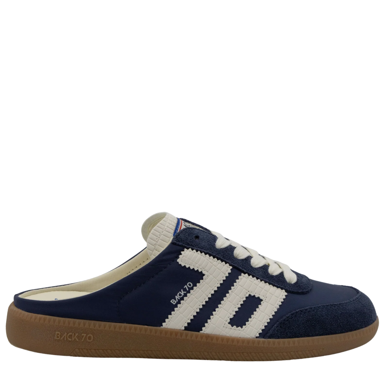 Navy blue slip-on shoe with white accents on a white background