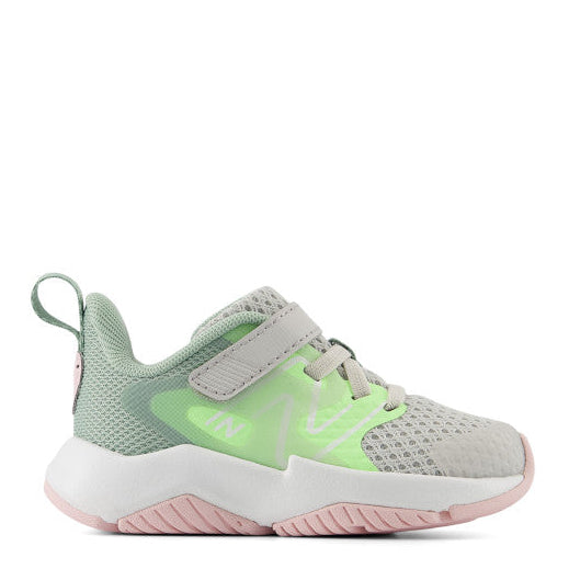 Children's sneaker with green and pink design on a white background