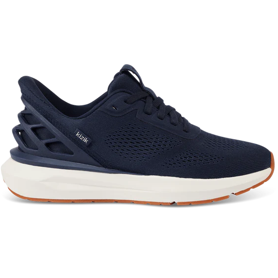 Navy running shoe with white sole on a white background
