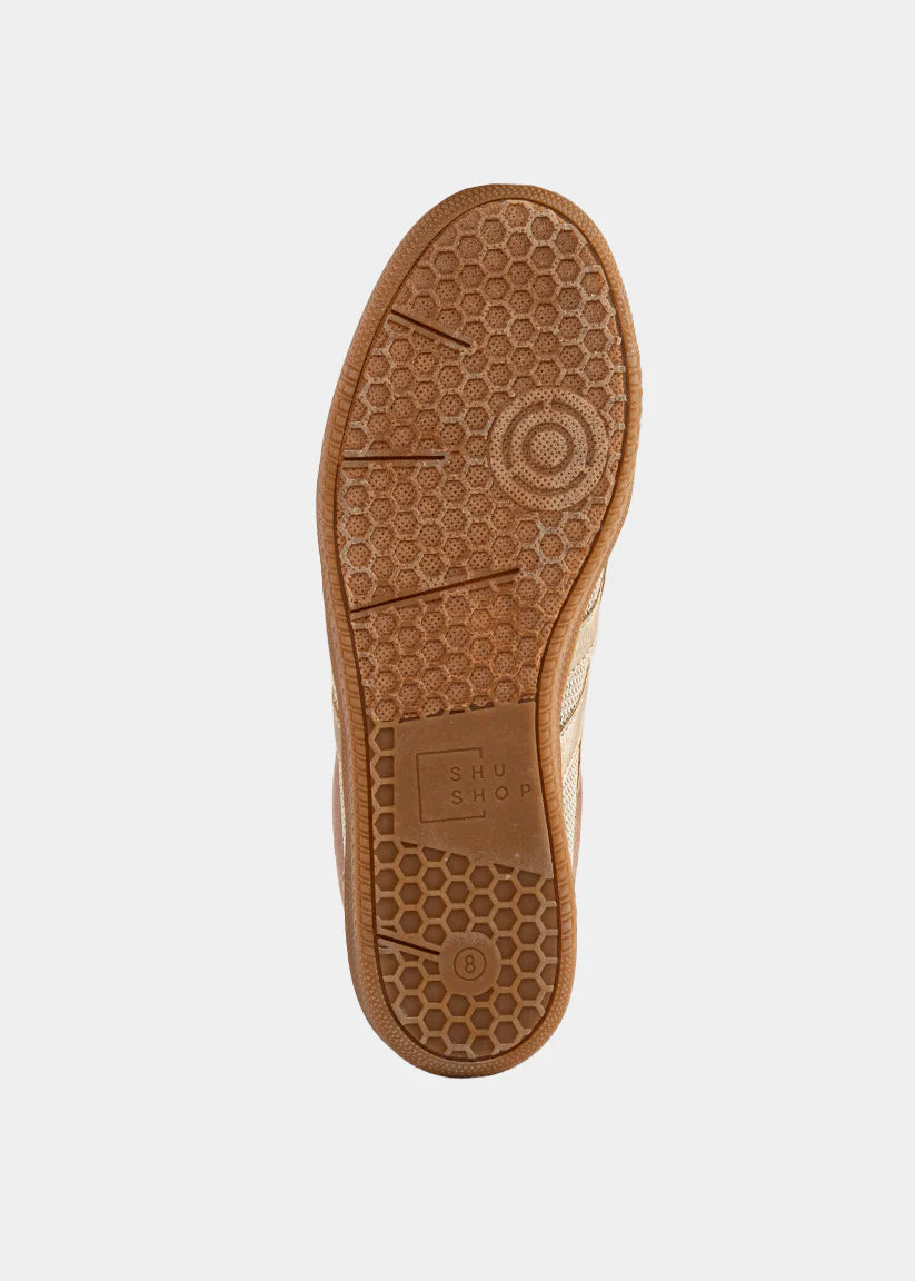 Brown shoe sole with a pattern on a white background