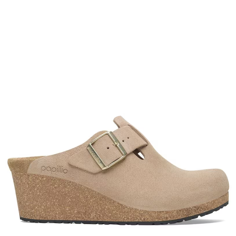 Beige clog shoe with a buckle on a white background