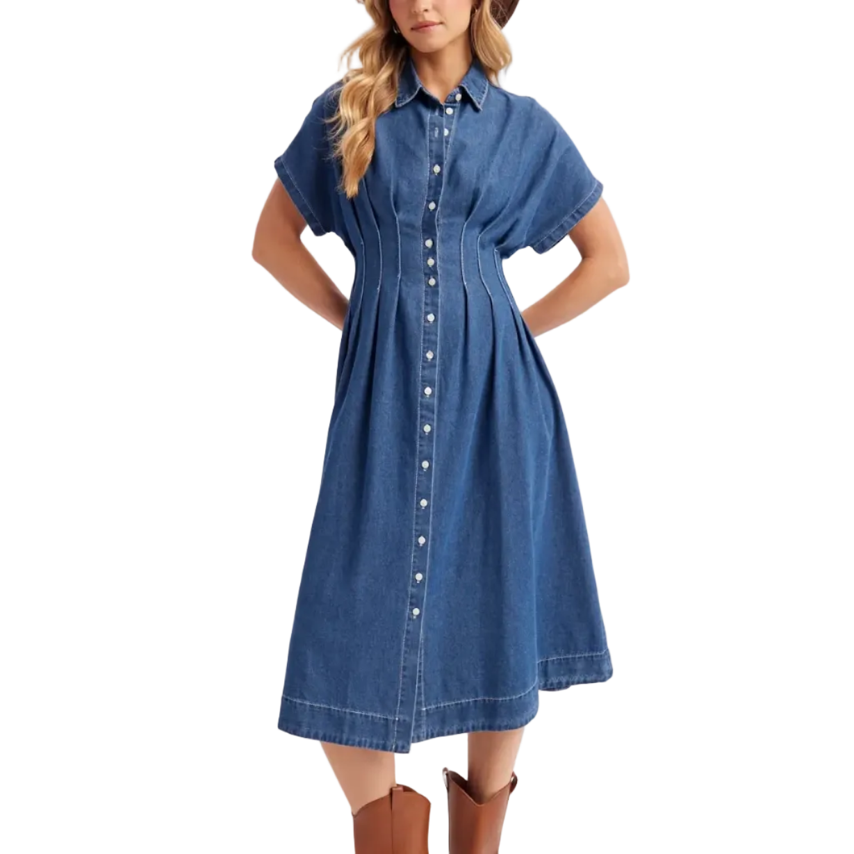 Woman wearing a blue denim dress with brown boots on a white background