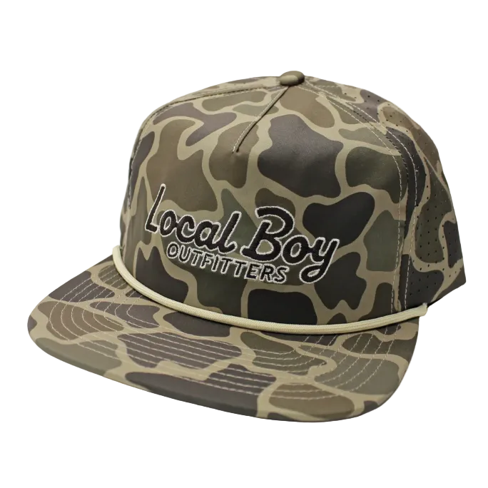 A camo baseball cap with 'LOCAL BOY' embroidered in black on the front, shown on a white background.
