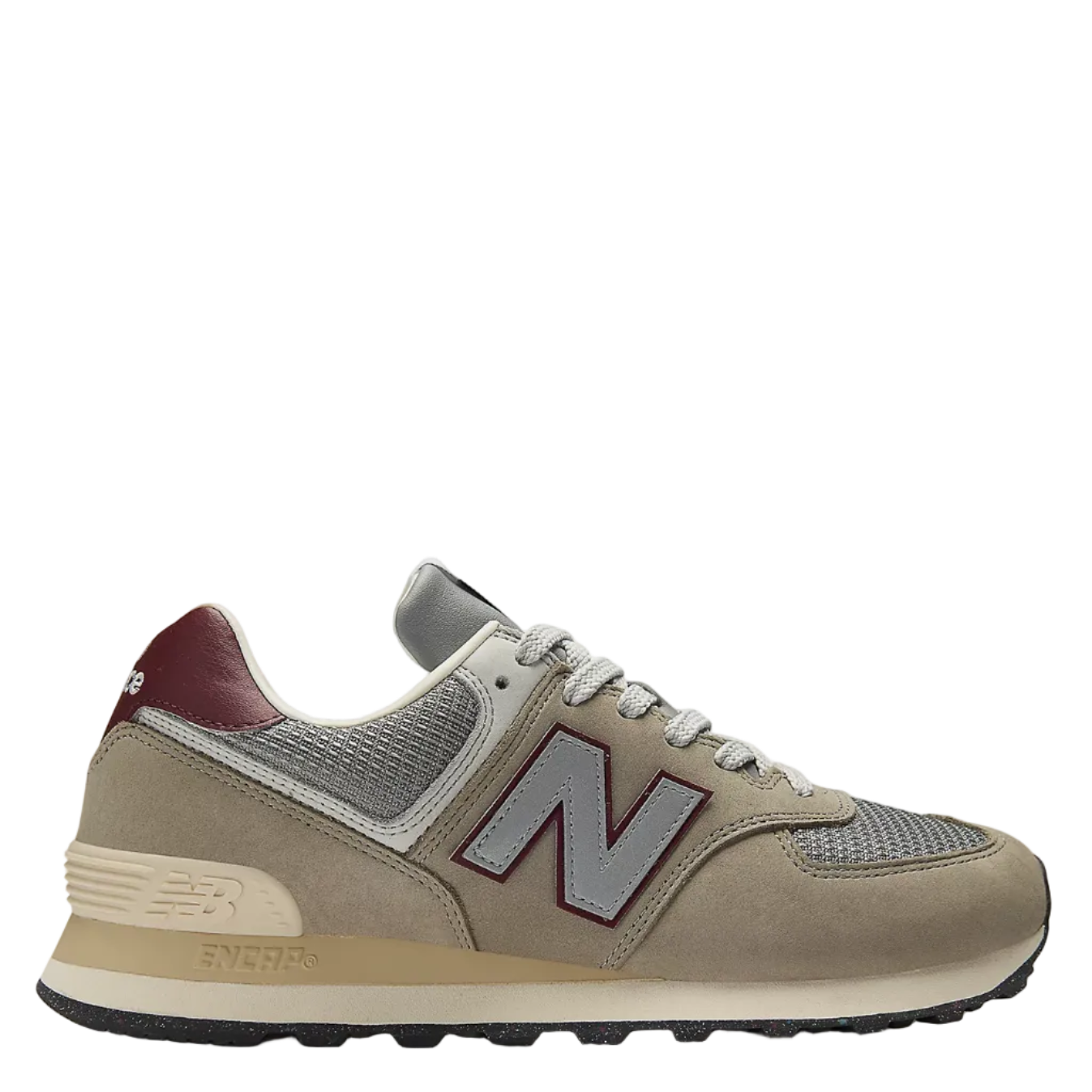 Beige sneaker with a visible brand logo on a white background