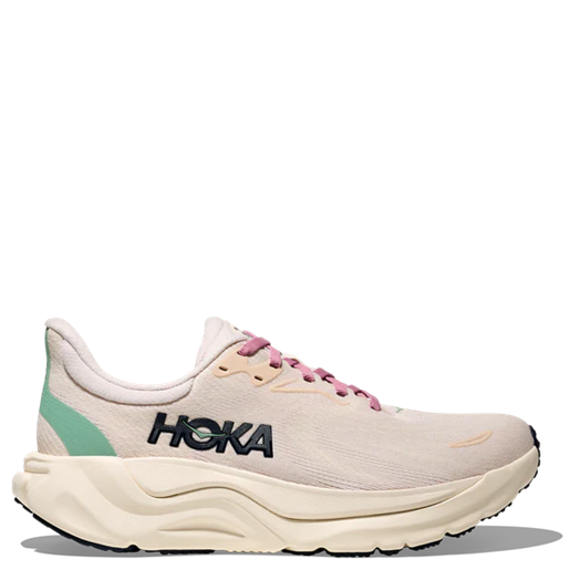 White running shoe with pink accents and Hoka branding on a white background