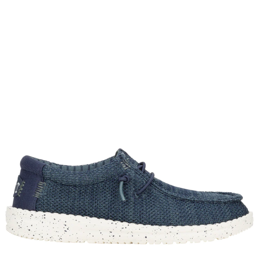 Blue casual shoe with white sole on a white background