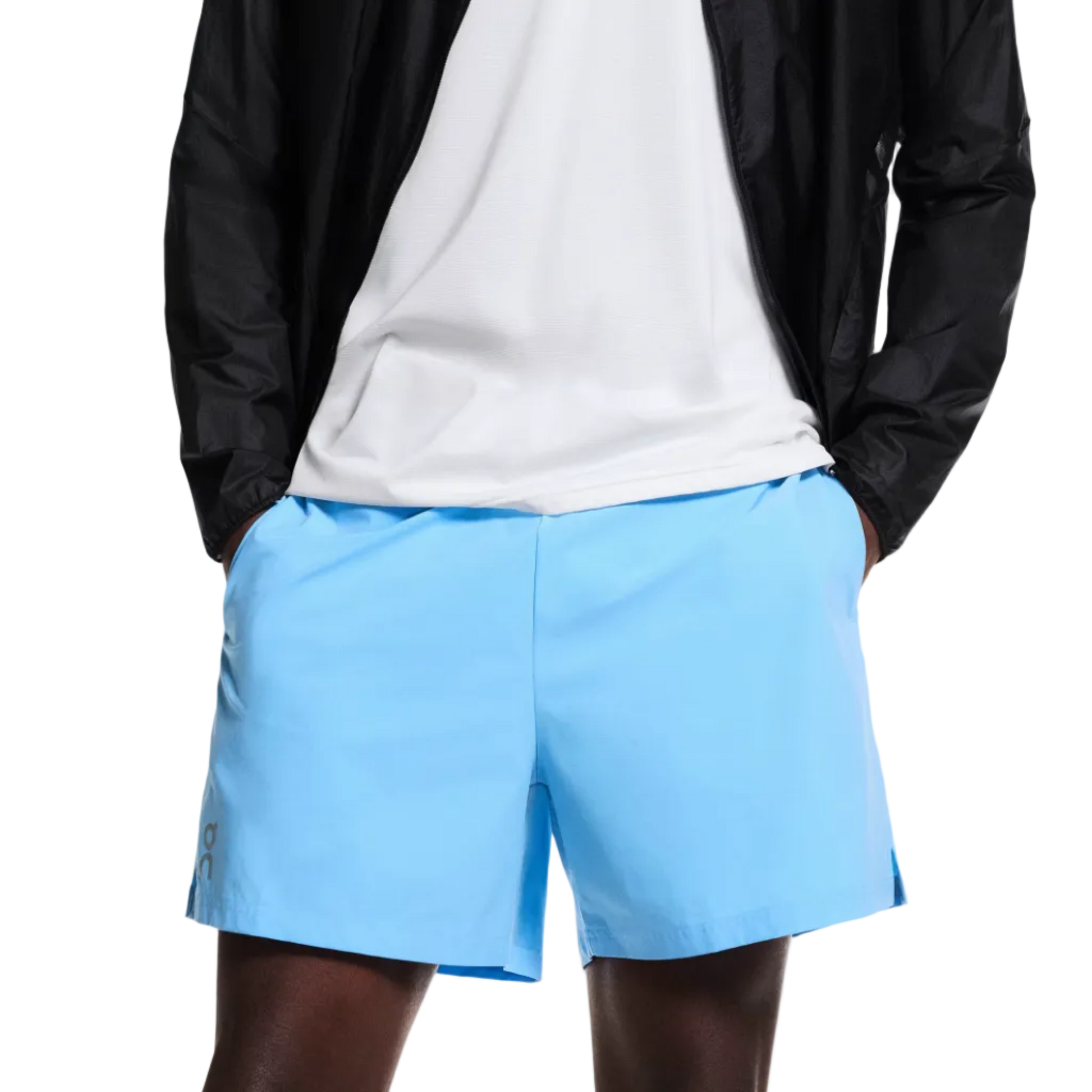 Man wearing a black jacket, white t-shirt, and light blue shorts on a white background