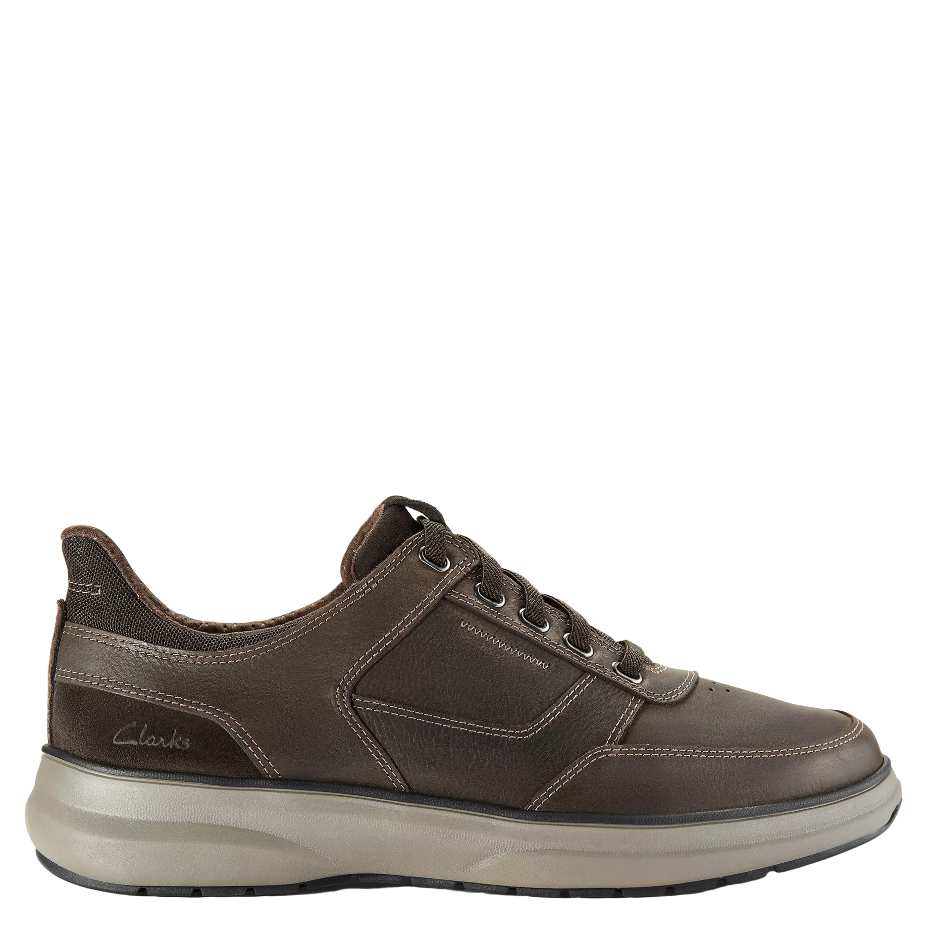 Brown leather shoe with white sole on a light gray background