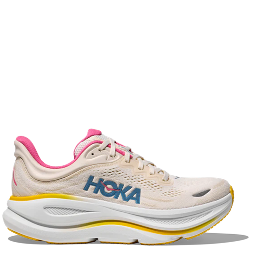 Beige running shoe with pink accents and 'Hoka' branding on a white background