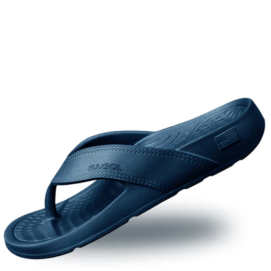 Blue sandal with 'Mukluk' branding on a white background