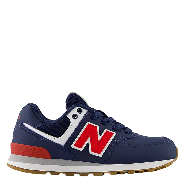Navy blue and red sneaker with New Balance logo on a white background