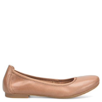 Tan leather flat shoe on a white background
