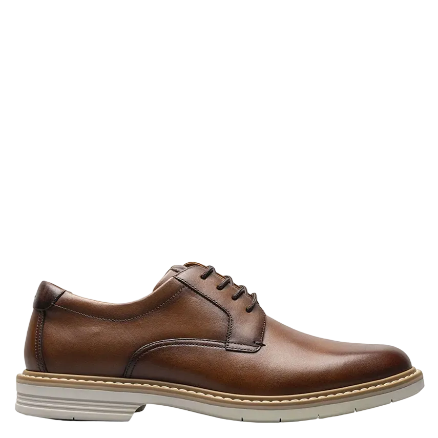 Brown leather dress shoe on a white background