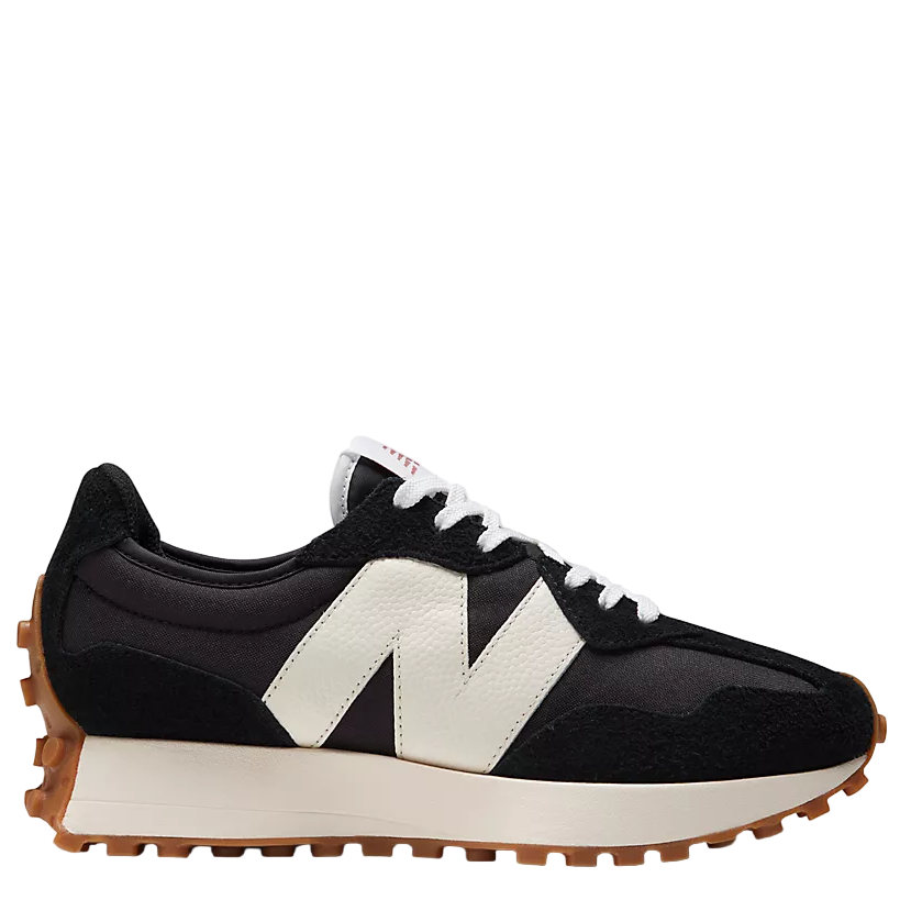 Black and white sneaker with a prominent 'N' logo on a light gray background