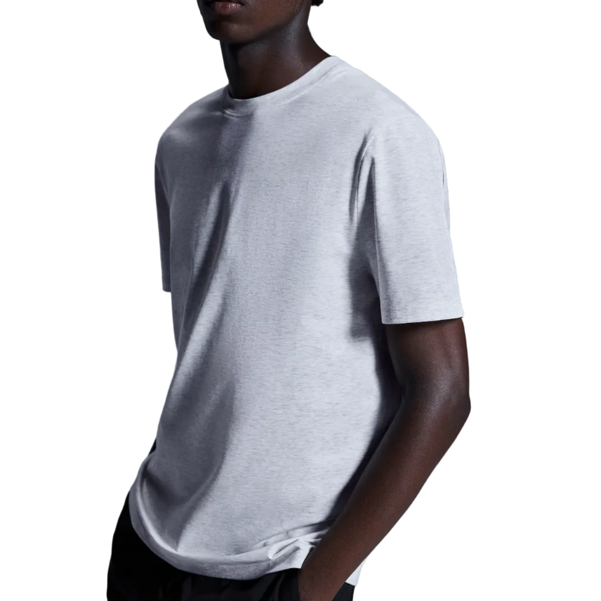 Person wearing a plain white t-shirt against a gradient gray background