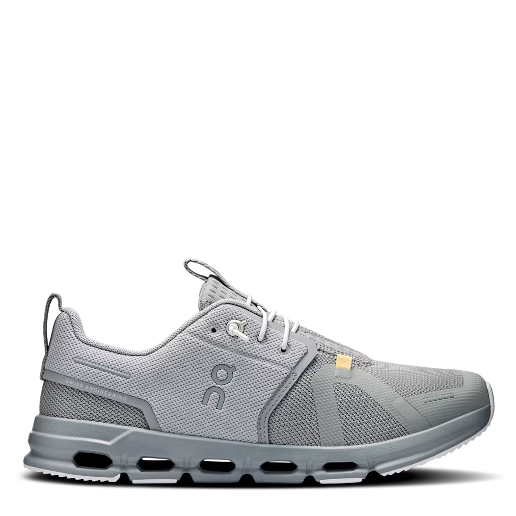 Gray athletic shoe with visible brand logo on a white background