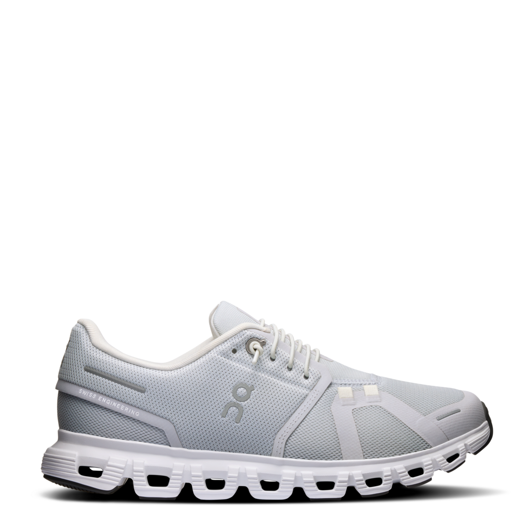 A pair of women's ON Running Cloud 6 sneakers in white color with a gray mesh upper and a white sole.