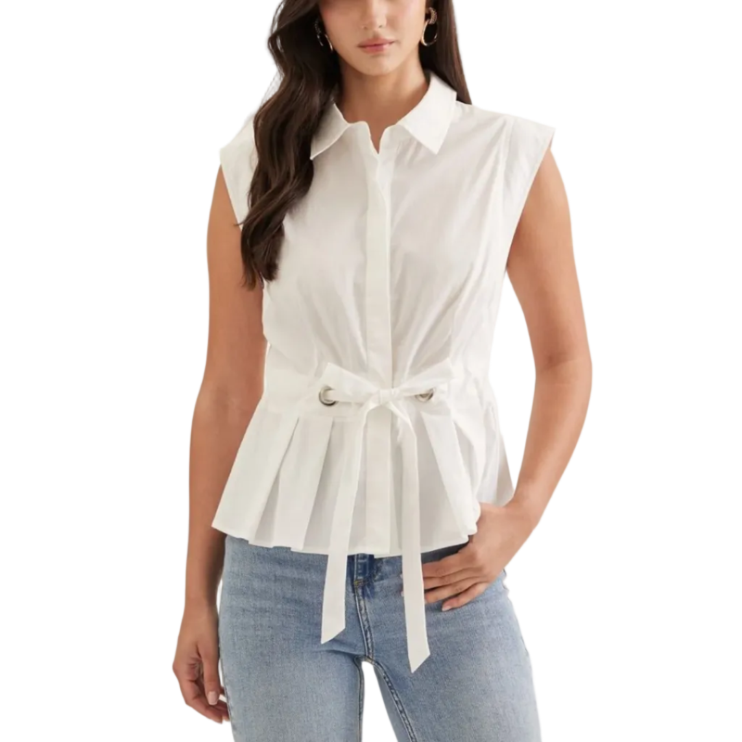 A woman modeling a white sleeveless collared blouse with a peplum hem and self-tie belt, paired with light-wash blue jeans against a plain light background.