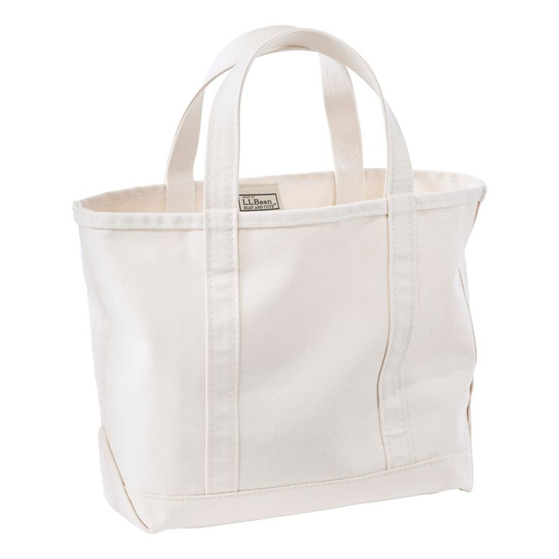 White tote bag with a visible brand label on a white background