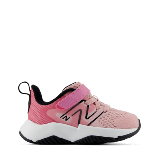 A pink New Balance sneaker for toddlers, featuring a hook-and-loop strap closure, a white midsole, and black accents, shown against a plain white background.
