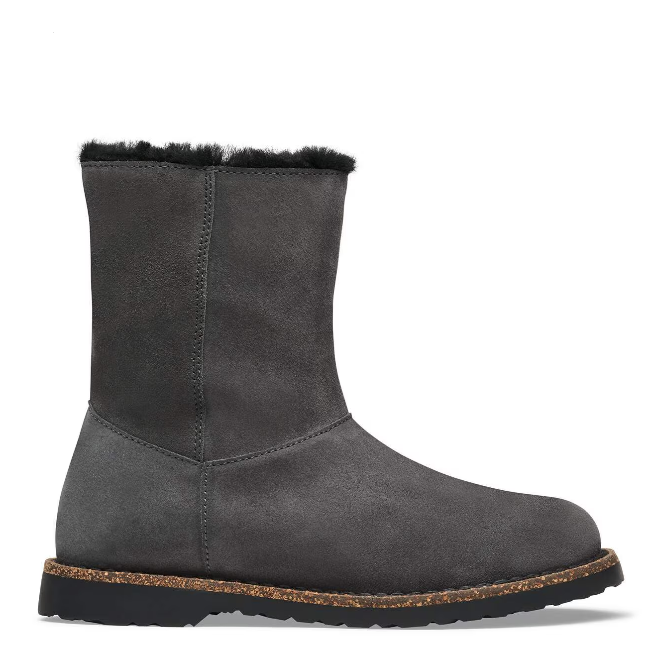 A dark gray suede ankle boot with black shearling lining visible at the top, a black sole, and a brown cork midsole, shown from a side profile on a white background.