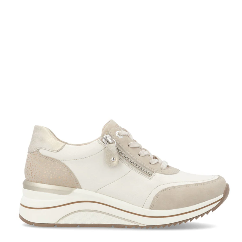 White sneaker with beige accents on a white background