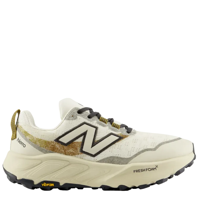White sneaker with gold accents on a white background