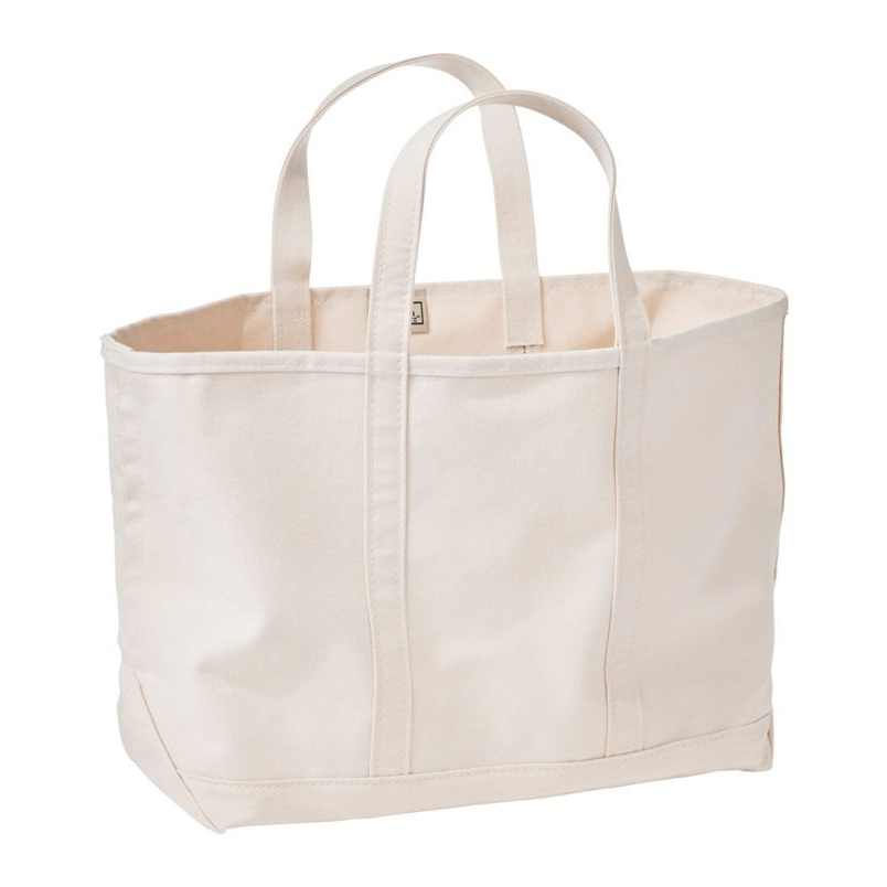 Beige tote bag with handles on a white background