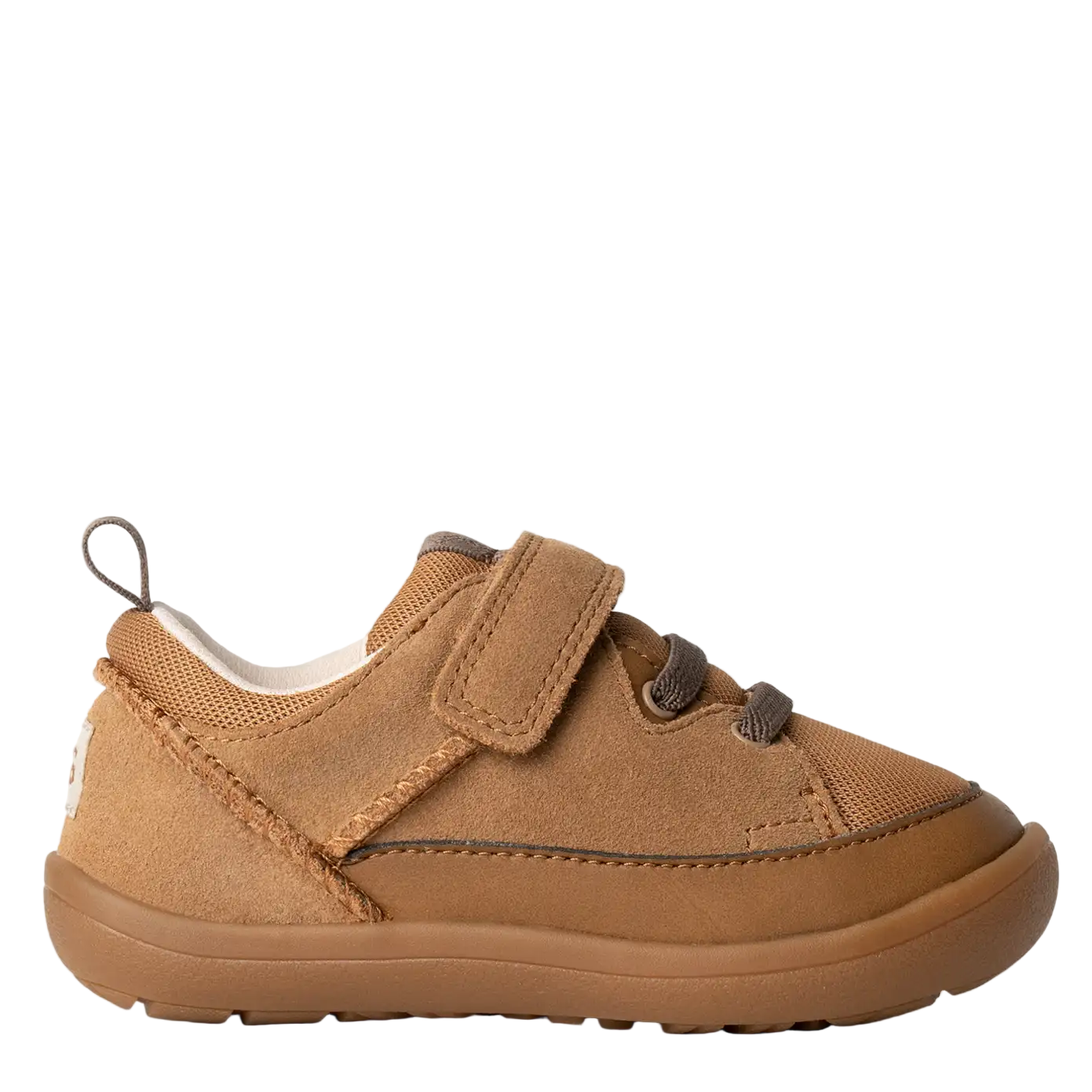 Brown children's shoe with velcro straps on a white background