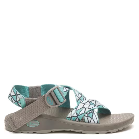 Sandal with gray strap and turquoise and white patterned straps on a white background