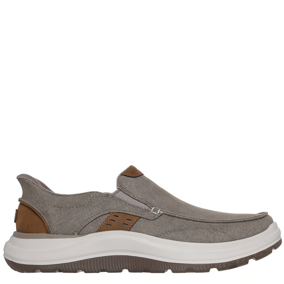 Gray slip-on shoe with brown accents on a white background