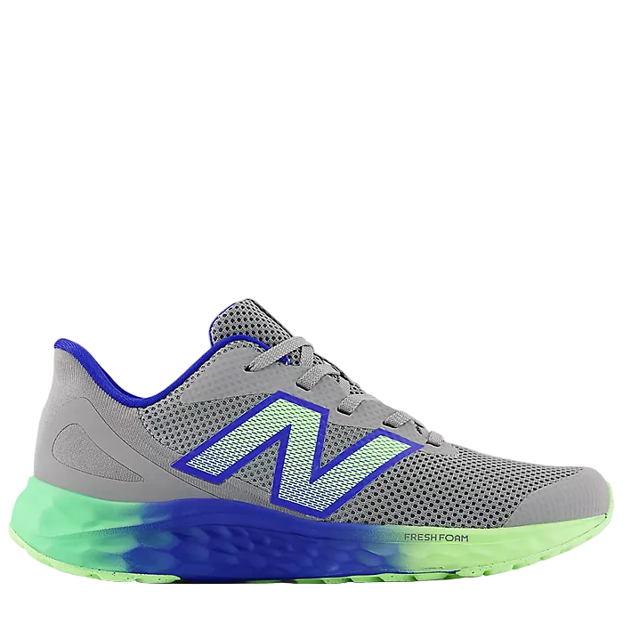 Gray running shoe with blue and green sole on a white background